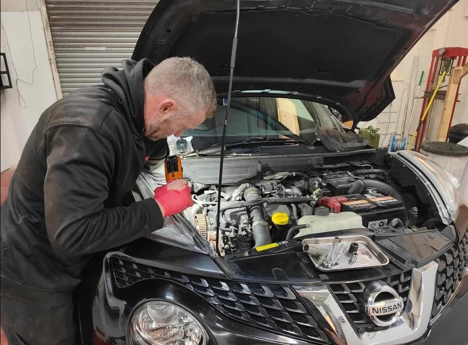 Mechanic working on a car